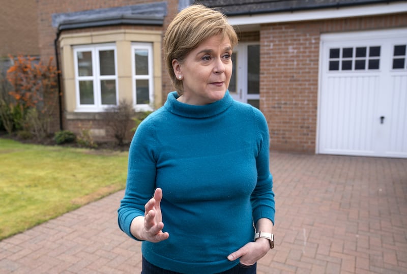 Former leader of the Scottish National Party (SNP) Nicola Sturgeon speaking to the media outside her home in Glasgow in 2023 during a probe into the party's finances. Photograph: PA