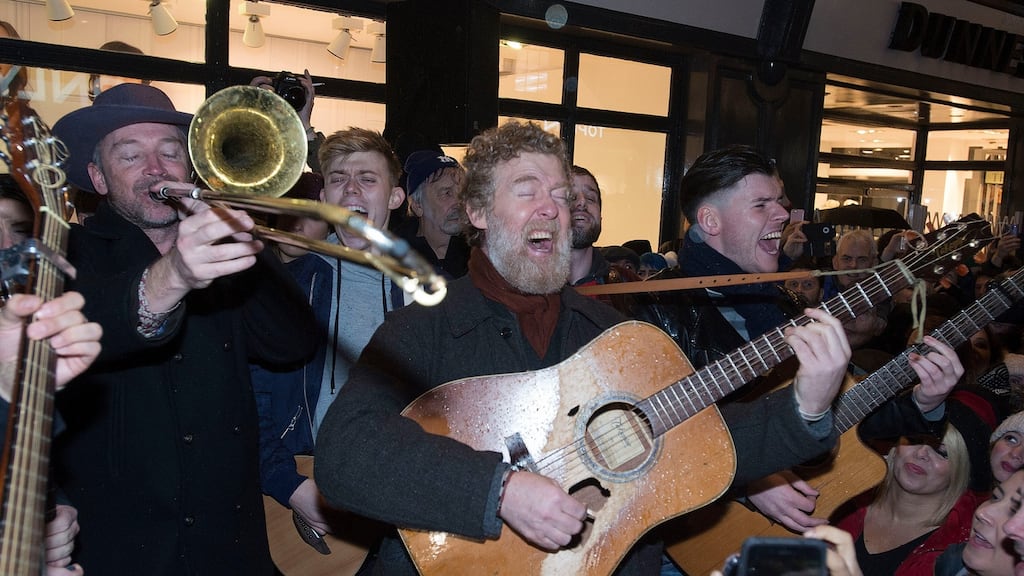 Glen Hansard of The Frames busking on Grafton Street on Christmas Eve.Photograph: Dave Meehan