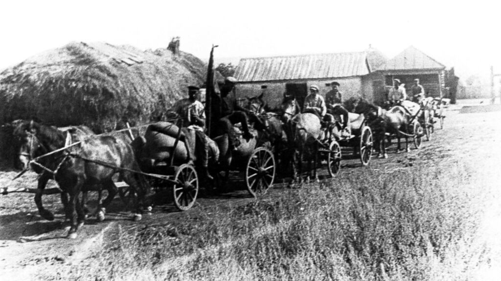 1932: carts laden with bread supplies sent by the Bolsheviks from a collective farm leave Alekseyevka in the Kharkiv region of Ukraine. Photograph: Sovfoto/UIG via Getty Images