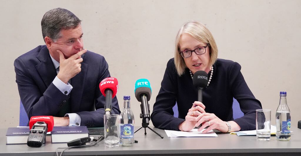 Finance Minister Paschal Donohoe and Prof Niamh Moloney speaking at launch of the report of the Commission on Taxation and Welfare at Dublin City University. Photograph: Niall Carson/PA