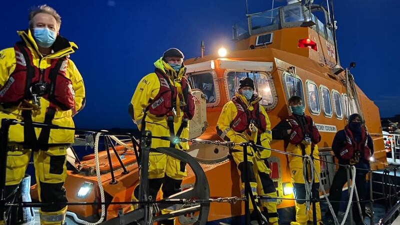 The Frederick Storey Cockburn lifeboat remained on standby 100m from the sinkhole while Rescue 115 hovered overhead as the Irish Coast Guard began planning the rescue operation. Photograph: Courtmacsherry Harbour Lifeboat