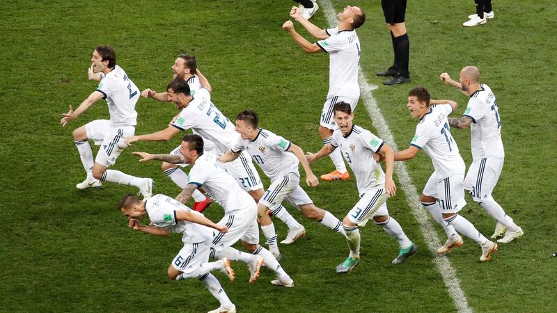 Russia players celebrate winning the penalty shoot-out against Spain. Photograph: Maxim Shemetov/Reuters