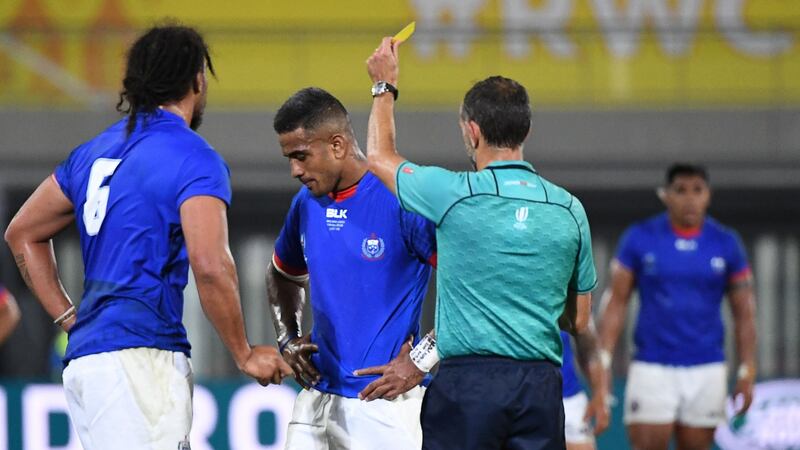 Romain Poite shows Samoa centre Rey Lee-Lo yellow card during his side’s Pool A clash with Russia. Photograph: William West/AFP/Getty
