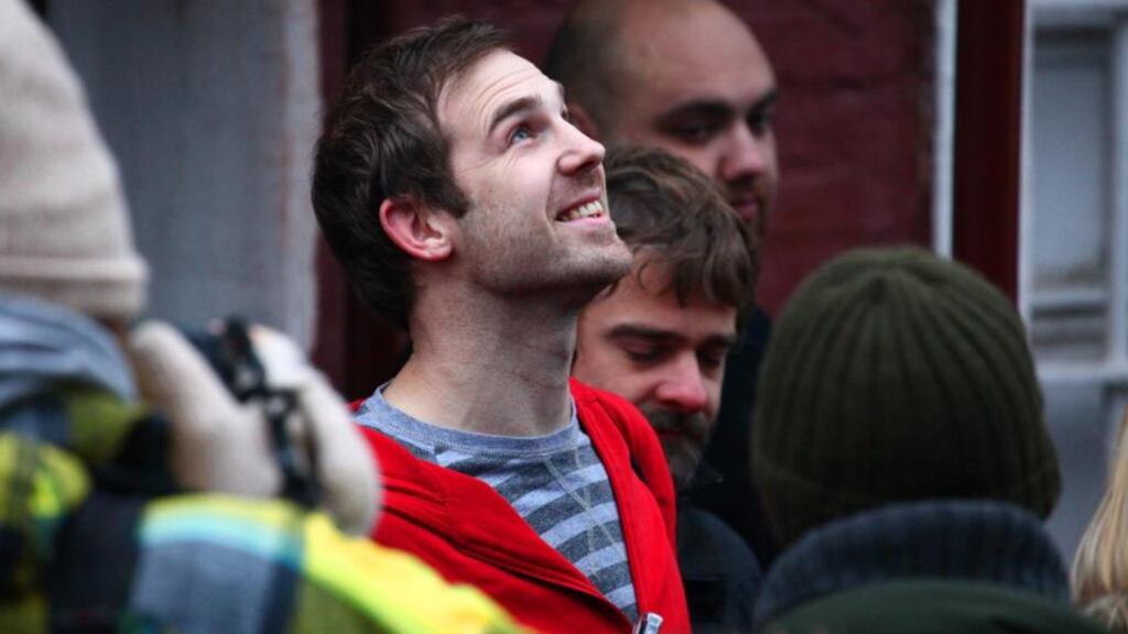 A handout picture provided by Greenpeace shows freelance videographer Kieron Bryan (centre) from Britain being released on bail from the Sizo 4 detention centre in St. Petersburg, Russia, today. The Primorskiy Court granted bail to Kieron this week pending the payment of 2 million ruble bail. He has now left the detention centre, but the conditions of his bail are not yet fully known. Photograph: Lize Udilova/Greenpeace/EPA