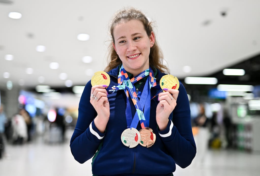 Róisín Ní Riain at Dublin Airport on April 28th with her gold, silver and bronze medals from the Para Swimming European Championships in Portugal. Photograph: Ben McShane/Sportsfile
