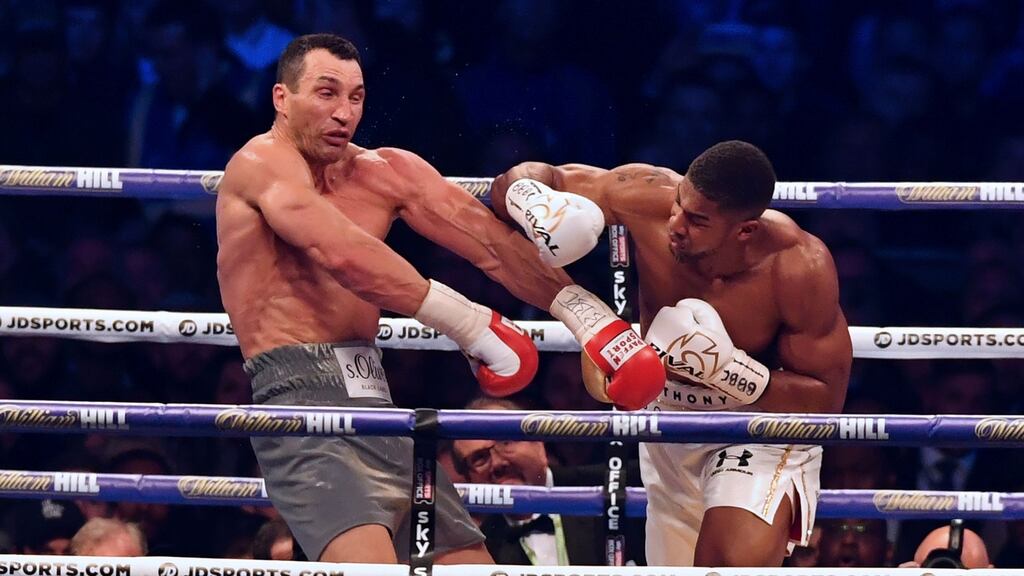 Anthony Joshua throws a punch at Ukraine’s Wladimir Klitschko in Wembley Stadium on Saturday night. Photograph: Getty Images