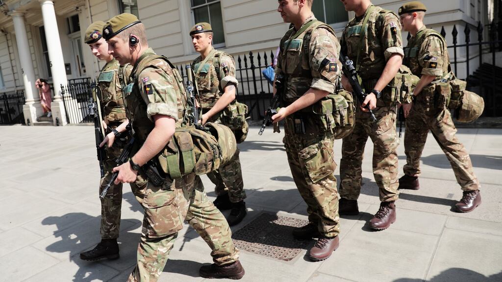 Soldiers are seen outside Buckingham Palace in London as military personnel are deployed around the country after the UK’s terror status was elevated to critical. The Manchester attack has prompted the Taoiseach to hold a meeting of security agencies. Photograph: Getty
