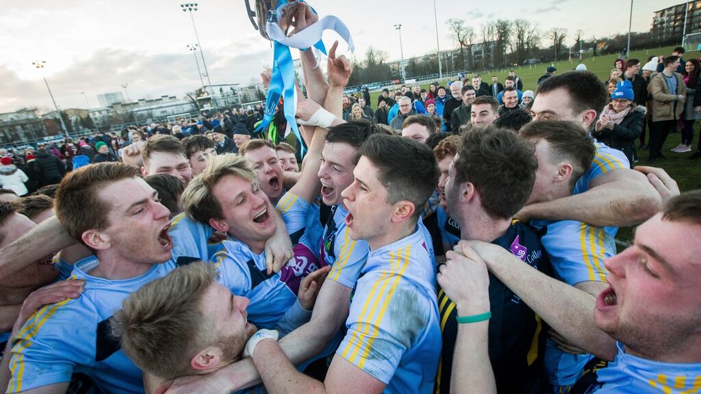 UCD players celebrate after winning the Sigerson Cup after a one-point victory over NUIG in Santry. Photograph:  Ryan Byrne/Inpho