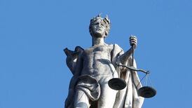 Woman seeks to overturn conviction for murdering neighbour with crucifix