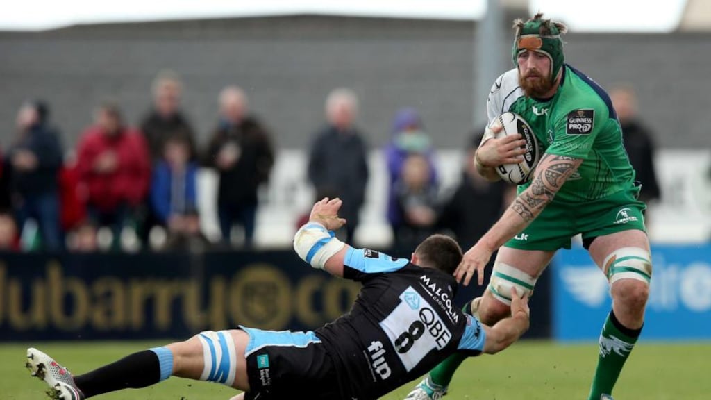 Connacht’s Aly Muldowney tries to evade Adam Ashe of Glasgow Warriors at the Showgrounds. Photograph: Ryan Byrne/Inpho