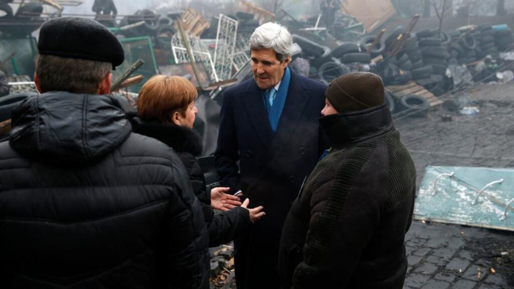 US secretary of state John Kerry stands beside a barricade at the Shrine of the Fallen in Kiev yesterday. Photograph: Reuters/Kevin Lamarque