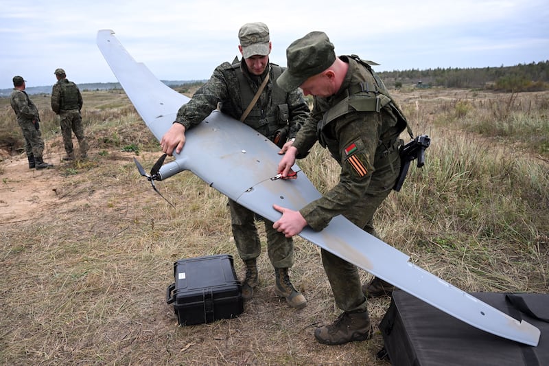 Belarusian servicemen work on an unmanned aerial vehicle during joint military drills with Russia at a training ground near the town of Borisov on Monday. Photograph: Olesya Kurpyayeva/AFP via Getty