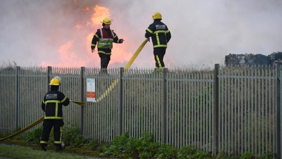 Firemen at the Oxigen recycling plant at the Merrywell Industrial Estate in Ballymount in Dublin. Photograph: Dara Mac Dónaill/The Irish Times