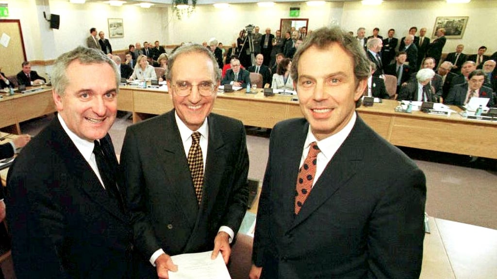 From left, former taoiseach Bertie Ahern, US senator George Mitchell, and former British prime minister Tony Blair smile after signing the Belfast Agreement in 1998. Photograph: Dan Chung/ AFP via Getty