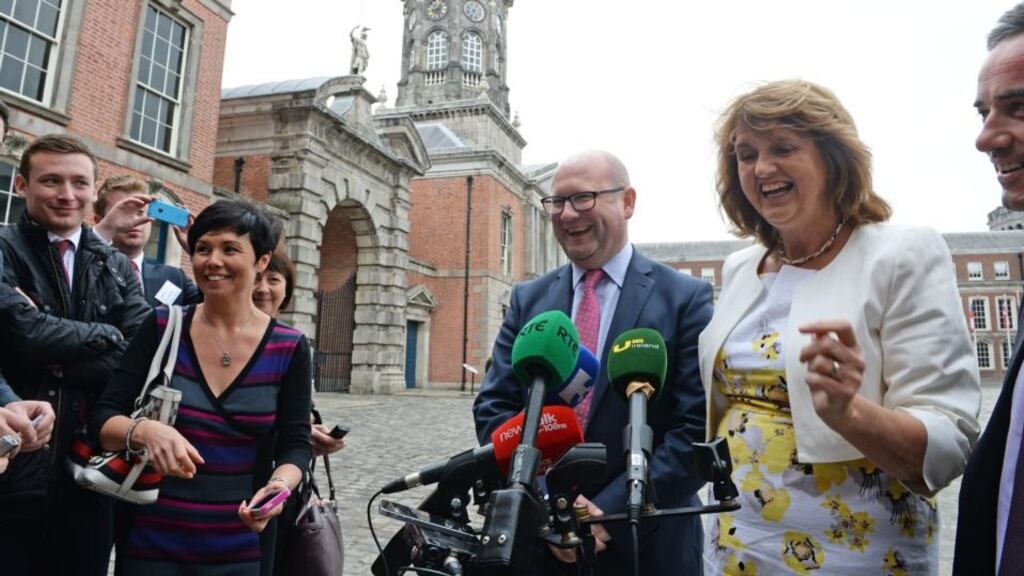 Tánaiste Joan Burton with Minister of State for Business and Employment Ged Nash speaking following the forum on the living wage at Dublin Castle. Photograph: Eric Luke/The Irish Times