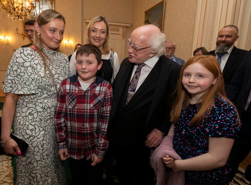 President Michael D Higgins with Maeby White, Rian Murphy, Clodagh White and Sadhb Murray who survived a serious accident in 2016 in Roscommon. Photograph: Colin Keegan, Collins Dublin