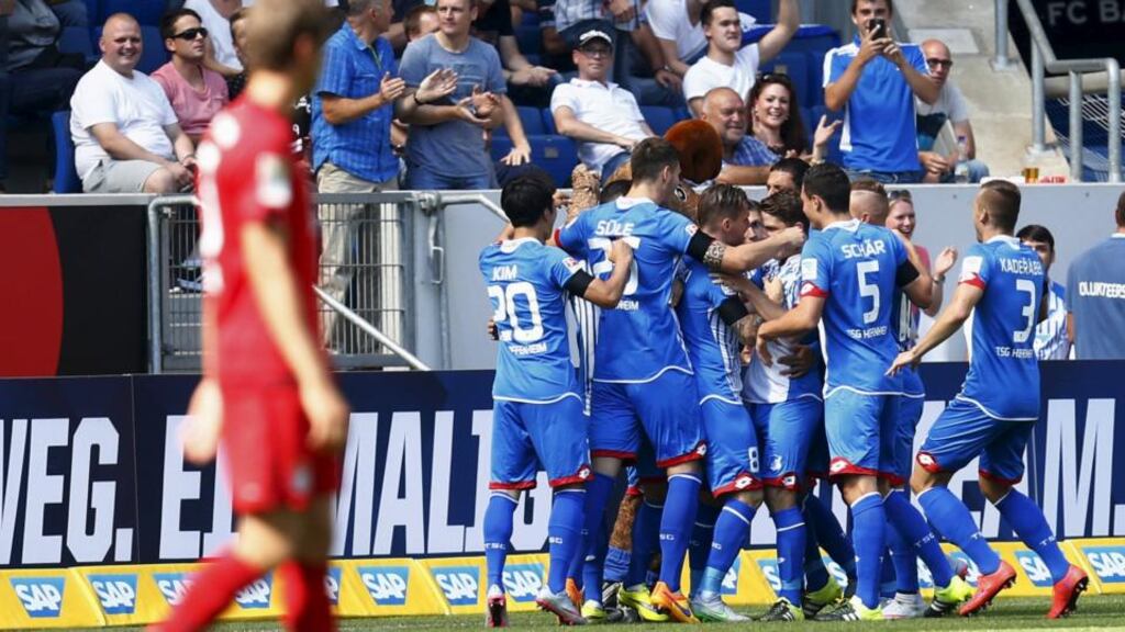 TSG 1899 Hoffenheim celebrate a goal against Bayern Munich, the joint fastest in the league’s history. Photograph: Ralph Orlowski/Reuters