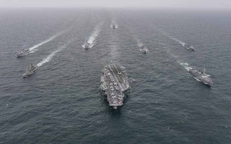 The South Korean navy's destroyer Yulgok Yi I (right), the US navy's aircraft carrier USS Nimitz (centre) and the Japan maritime self-defense force's Umigiri, (left) sail in formation during a joint naval exercise in international waters off South Korea's southern island of Jeju in April. Photograph: South Korean Defense Ministry via Getty Images