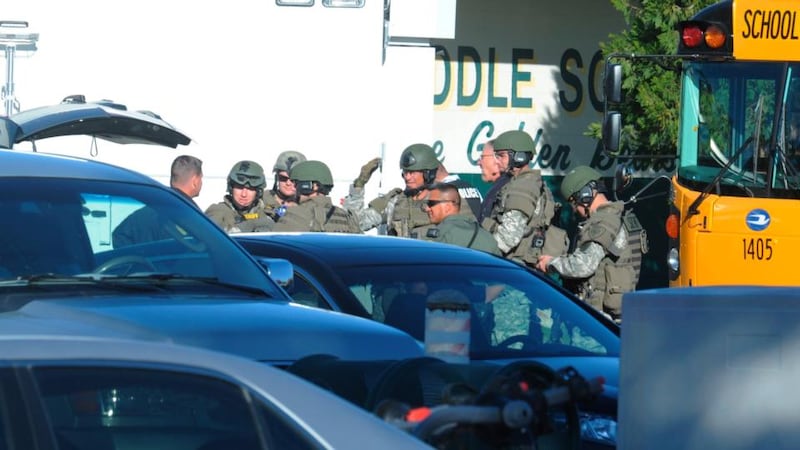 Police officers at the shooting scene at the Sparks Middle School in Sparks, Nevada, today. Photograph: Marilyn Newton/Reno Gazette-Journal/Reuters