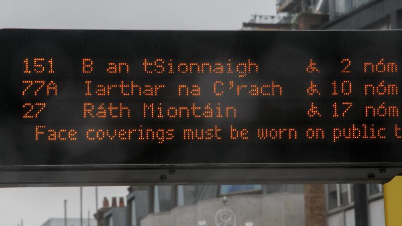 An electronic sign at a Dublin  Bus stop notes that  commuters on services must wear facemasks during the continuing Covid-19  pandemic. Photograph: Gareth Chaney/Collins