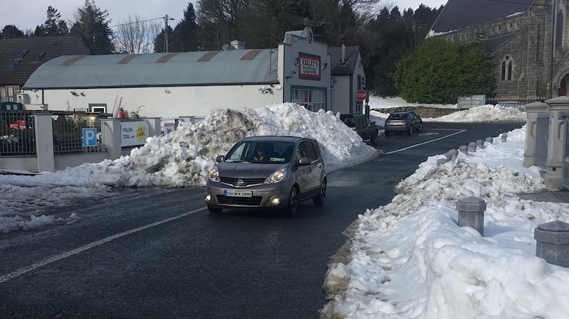 A car drives through snow in Roundwood, Co Wicklow, on Monday. Photograph: Tim O’Brien