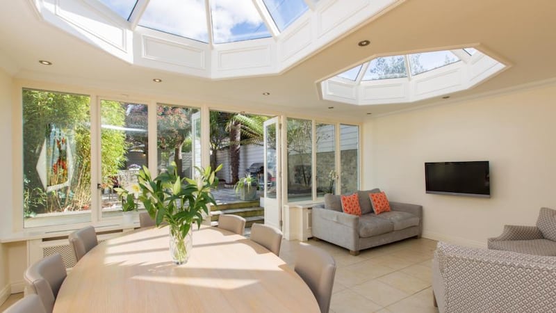 The large dining and living space to the rear of the kitchen at 66 Tritonville Road in Sandymount is remarkably bright thanks to two roof lanterns and walls of glass.