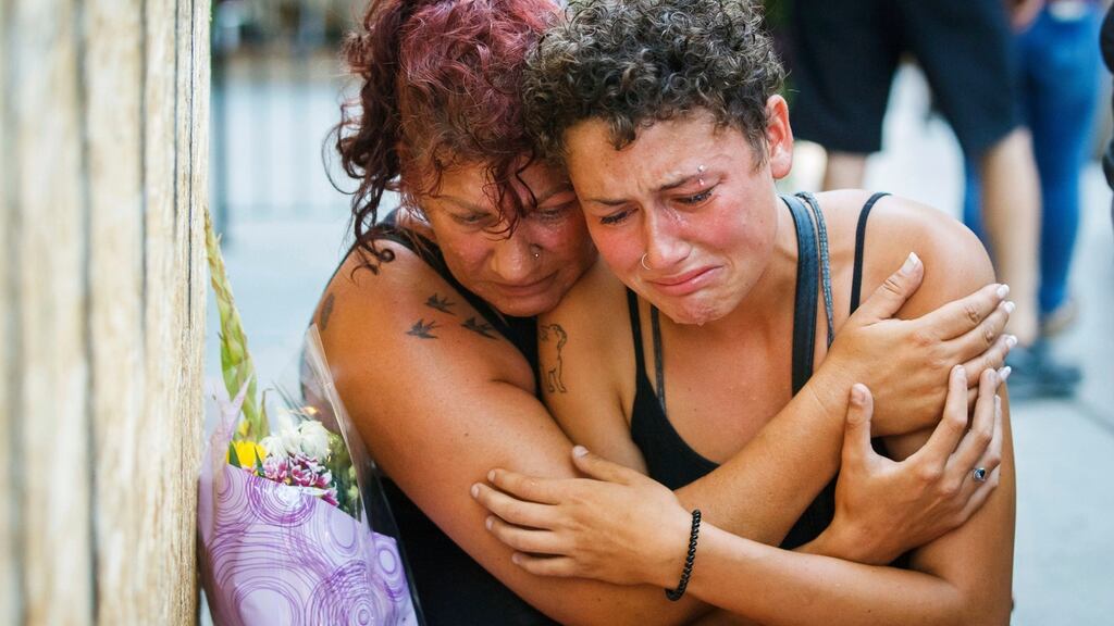 Gina Shapiro and her daughter Desirae, friends of 18-year-old Toronto shooting victim Reese Fallon, at a makeshift memorial in the Canadian city on Monday. Photograph: Mark Blinch/The Canadian Press via AP