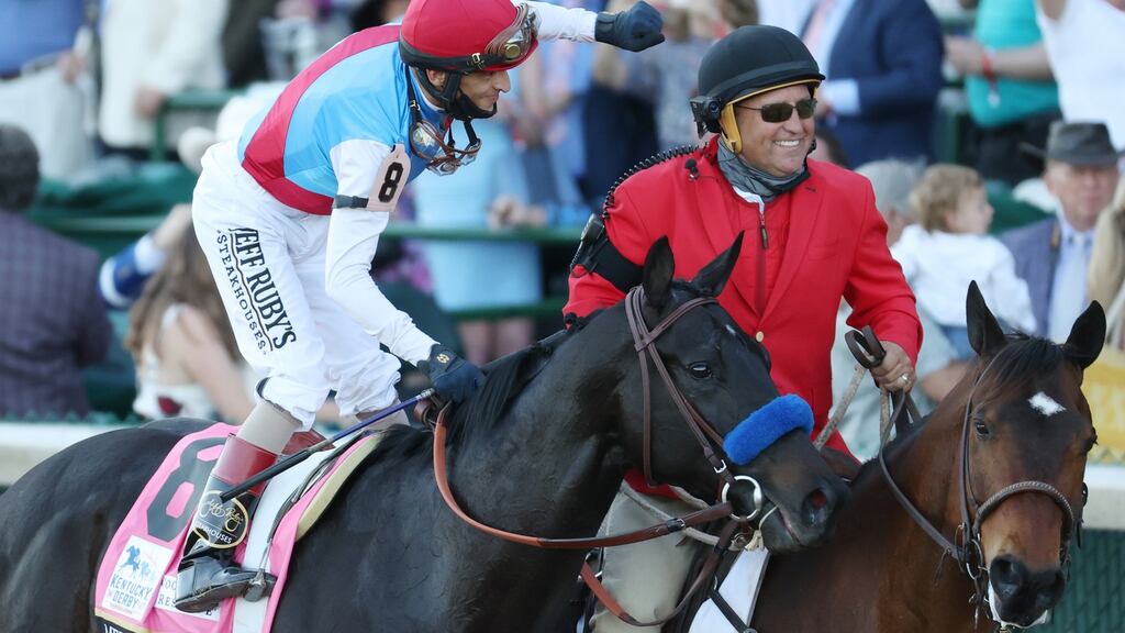Jockey John Velazquez celebrates after  Medina Spirit’s win at the 2021 Kentucky Derby at Churchill Downs in Louisville, Kentucky. Photograph: Andy Lyons/Getty Images