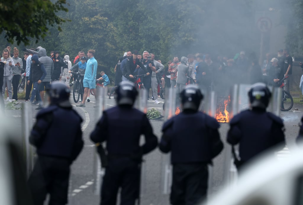 Gardai at the scene of violent protests at the former Crown Paint factory site in Coolock, Dublin, last July. Photograph: Colin Keegan/Collins Dublin