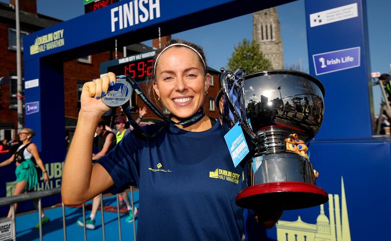 Women’s race winner Nichola Sheridan with her trophy. Photograph: Ryan Byrne/Inpho