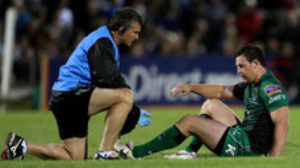 Connacht physio Gavin Malouf attends to Willie Faloon. Photograph: James Crombie/Inpho