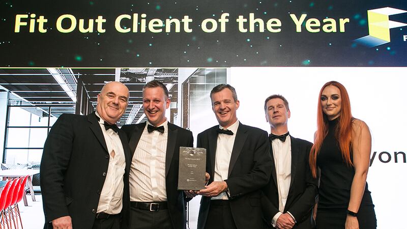 Richard Hemming, MD, StructureTone, presents the Fit Out Client of the Year award to the CRH & Henry J. Lyons teams