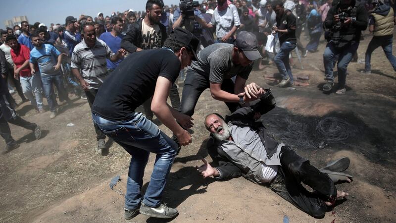 An elderly Palestinian after being shot by Israeli troops during a deadly protest at the Gaza Strip’s border with Israel, east of Khan Younis, Gaza Strip. Photograph: Adel Hana/AP