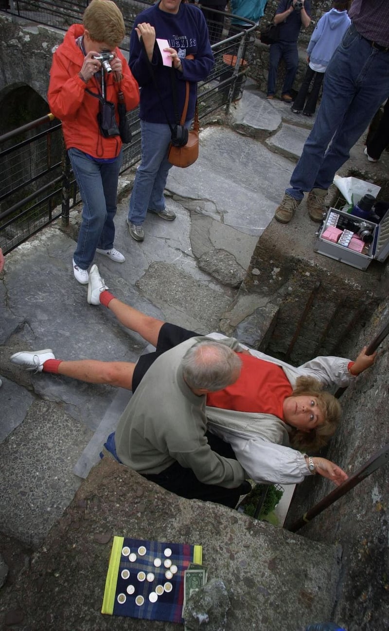Keen to kiss the Blarney Stone with a little help from a friend. Photograph: Bryan O’Brien/The Irish Times