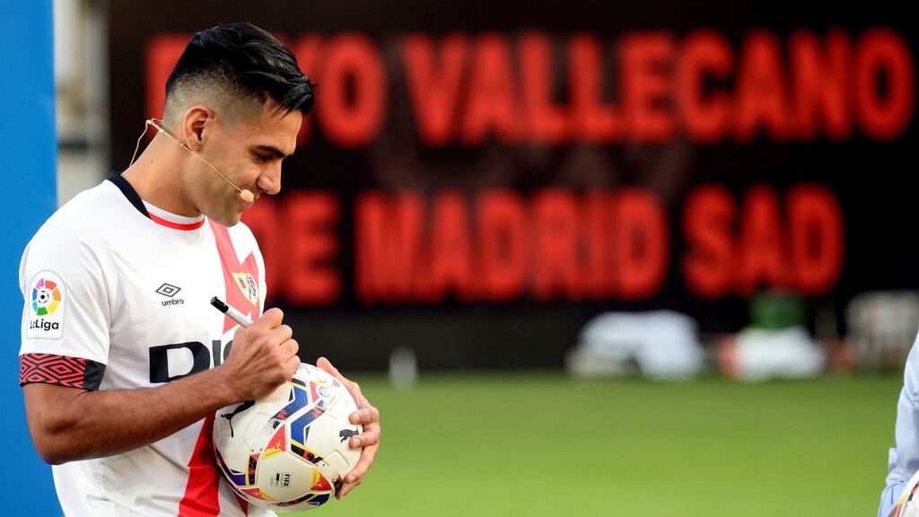 Rayo Vallecano striker Radamel Falcao signs an autograph during his presentation at Vallecas stadium. Photograph: EPA