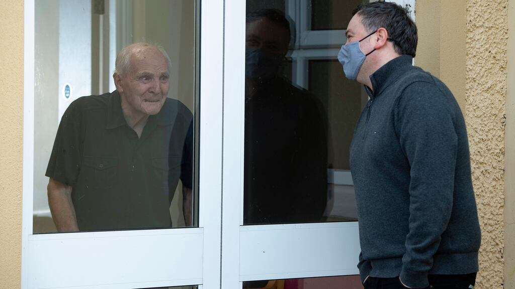 Cathal Doherty visits his father, John, in a care home in St Columbcille Village in Clonmany, Co. Donegal. Photograph: Joe Dunne