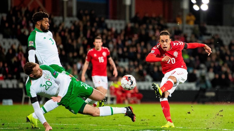 Denmark’s Yussuf Poulsen has a shot blocked by Richard Keogh. Photo: Bo Amstrup/Getty Images