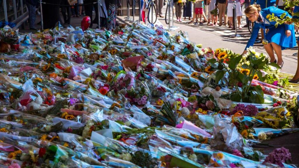 A KML stewardess pays her respects at Schiphol Airport during a national day of mourning for the victims killed in Thursday’s Malaysia Airlines Flight MH17 plane disaster, in Schiphol. Photograph: Cris Toala Olivares/Reuters
