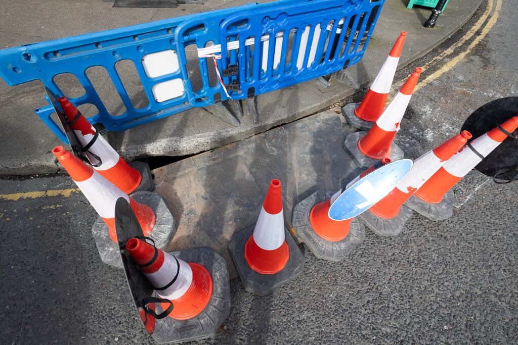The sinkhole more than 1 metre deep, and covering an area of 5sq m, appeared at Sandymount Green in the road in front of the Mace shop. Photograph: Sam Boal/Collins Photos