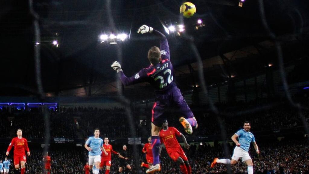 Liverpool goalkeeper Simon Mignolet fails to stop a shot from Alvaro Negredo of Manchester City (right) during the Premier League game  at the Etihad Stadium. Photograph: Phil Noble/Reuters