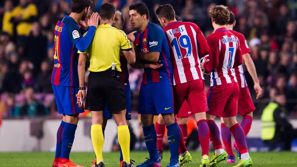 Luis Suarez of FC Barcelona argues with referee Jesus Gil Manzano after being shown a red card during the Copa del Rey semi-final against Atletico de Madrid at Camp Nou. Photo: Alex Caparros/Getty Images