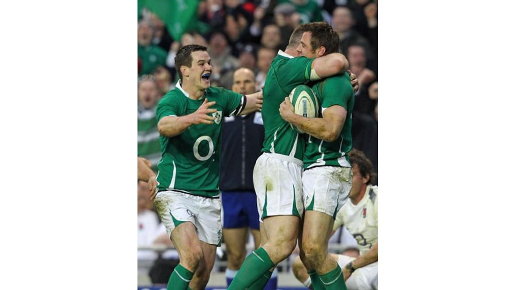 Ireland wing Tommy Bowe (right) celebrates scoring his try with Prop Cian Healy (2nd left) and outhalf Jonathan Sexton (left) during the Six Nations match between Ireland and England at Aviva Stadium in Dublin - (Photograph: Peter Muhly/AFP Photo)