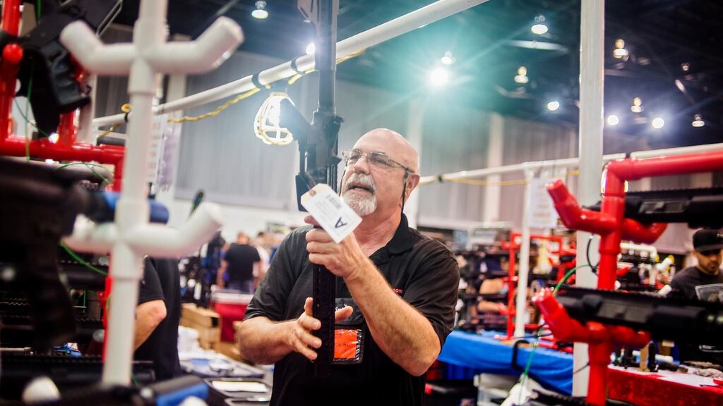 Scott Rollf, a seller at the Florida Gun Show. Rollf says he approves of raising the age minimum and is fine with banning bump stocks and other attachments that boost firing speeds. Photograph: Zack Wittman/The New York Times