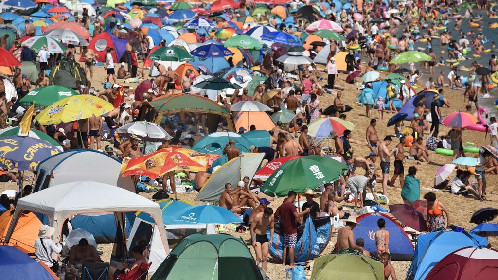 During peak season, about 40,000 people visit Fujiazhuang beach in Dalian every day. Photograph: VCG