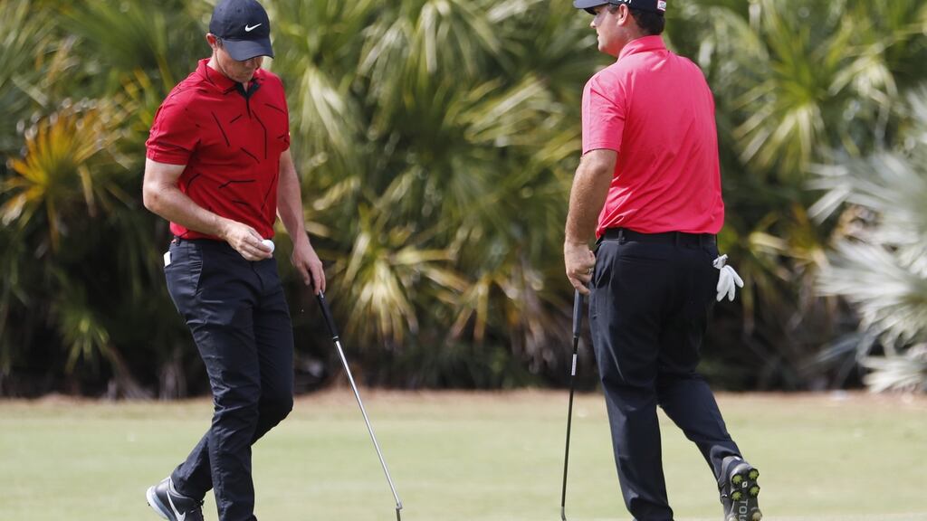 Several members of the PGA Tour took to the course on Sunday emulating the wardrobe of Tiger Woods - a red shirt and black pants - to honour the golf great, who was seriously injured in a single-car crash on Tuesday. Photograph: EPA