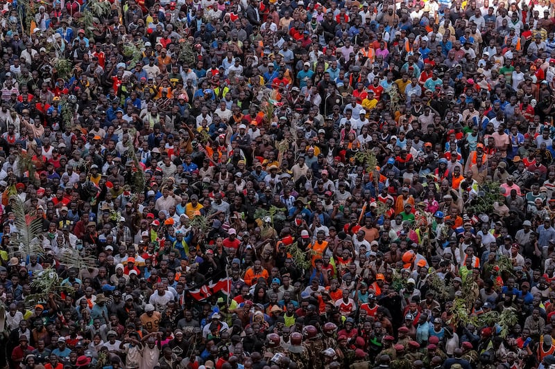 Supporters of Kenyan opposition leader Raila Odinga gather ahead of the public viewing of his coffin at the Kasarani Stadium in Nairobi. Photograph: Kabir Dhanji/AFP via Getty Images