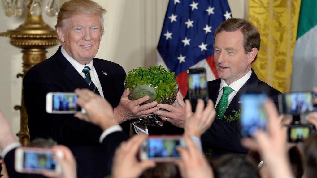 Donald Trump receiving a bowl of shamrock from Enda Kenny at the White House in March. Photograph: EPA