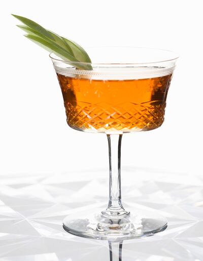 Manhattan with apple garnish