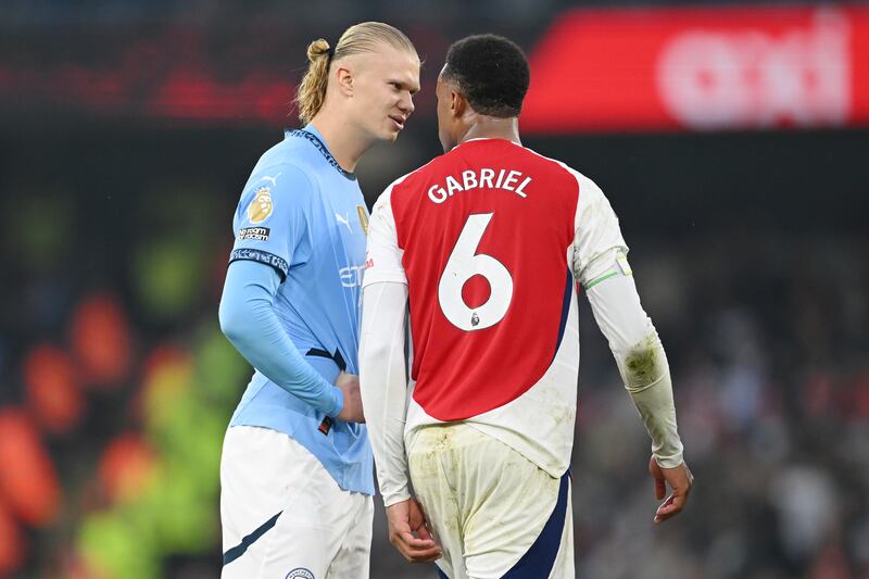 Erling Haaland of Manchester City speaks to Gabriel of Arsenal. Photograph: Michael Regan/Getty