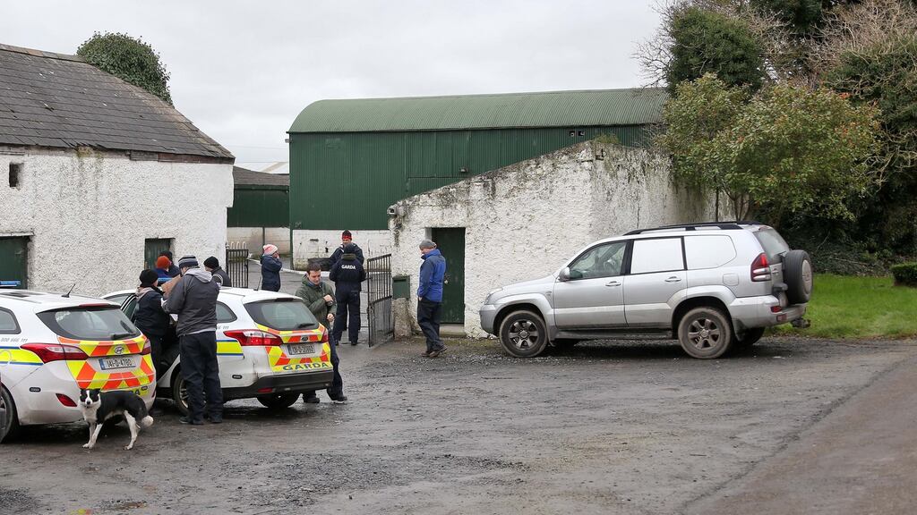 Gardaí search in farmhouses and at a lake in the area around where the dismembered body of Kenneth O’Brien was found last weekend. Photograph: Colin Keegan/Collins